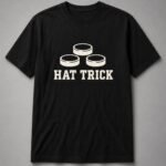 Hat Trick Hockey Pucks Unisex T-Shirt - Black